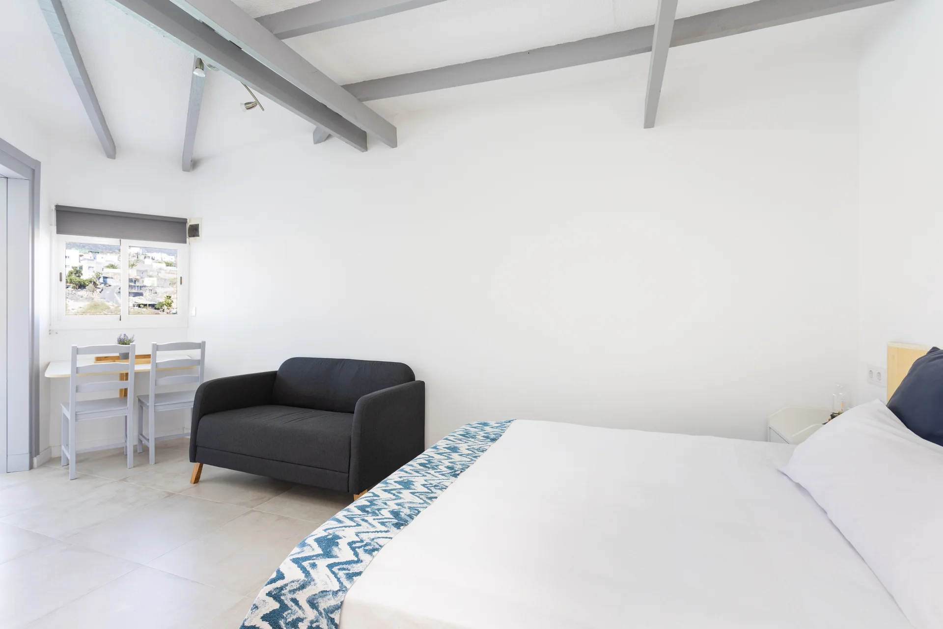 Bed view to entrance sofa
